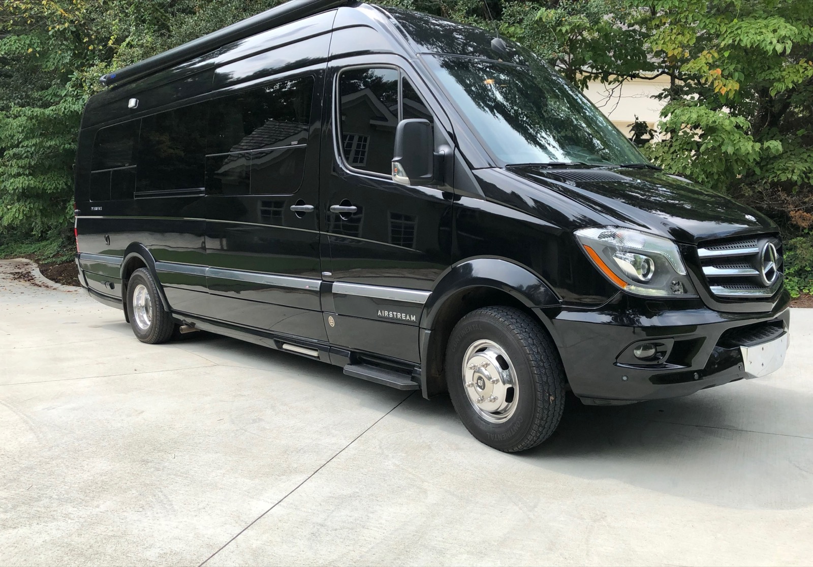 Black Mercedes-Benz Sprinter luxury van